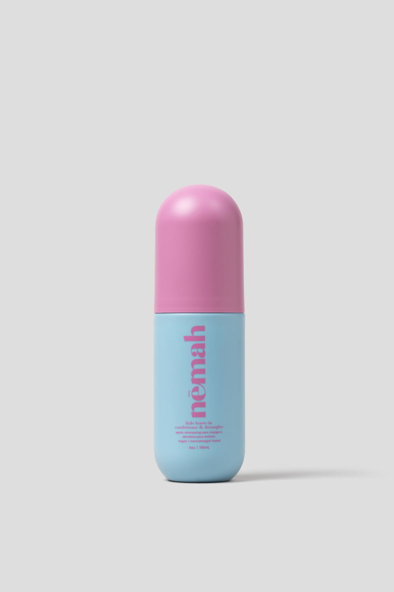 Blue and pink cylindrical product with 'nemah' branding on a light gray background