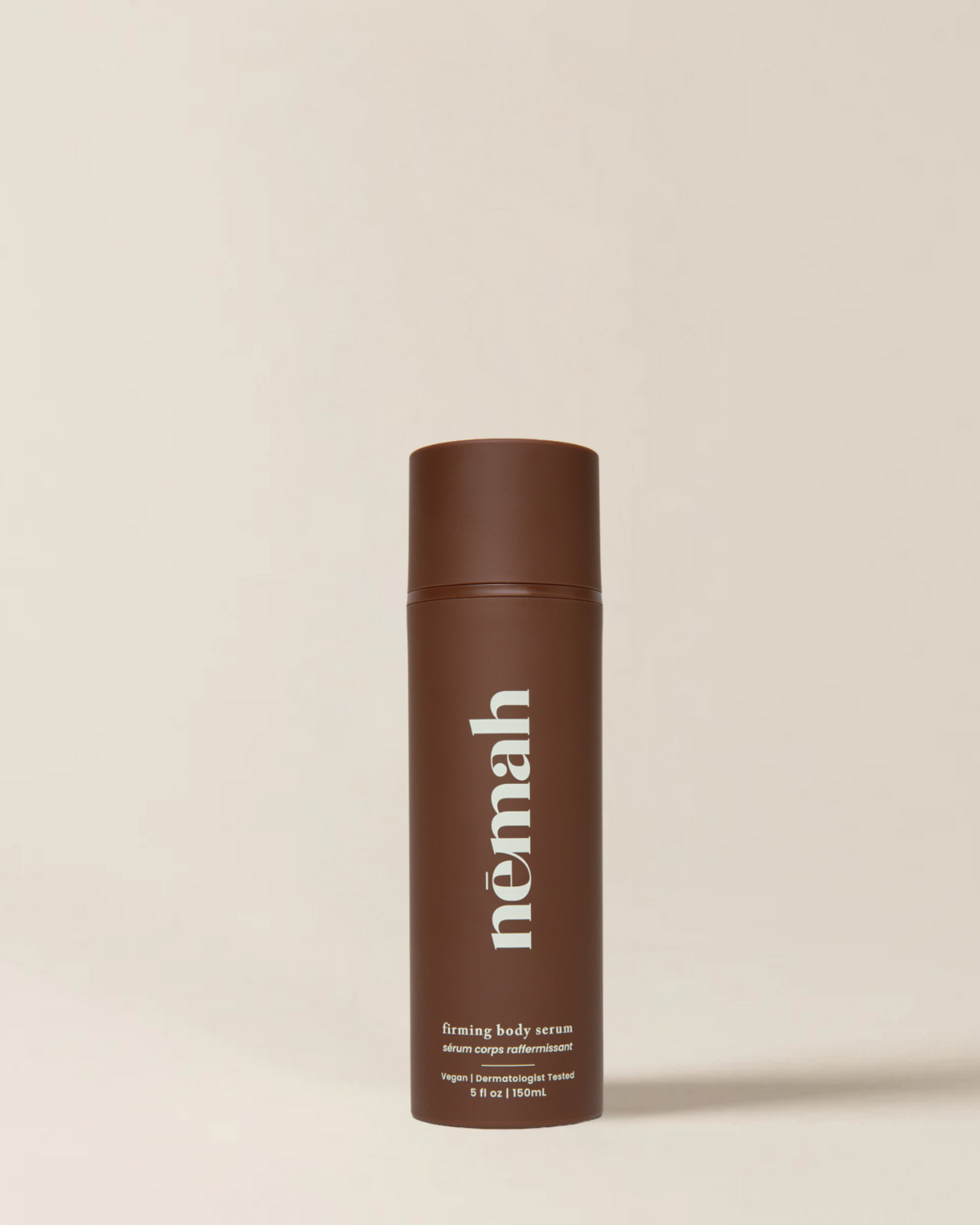 Brown bottle labeled 'nēmah' firming body serum, vegan, dermatologist tested, 5 fl oz | 150 mL