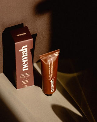 Nemah restorative scar treatment tube and matching box on a shadowed surface